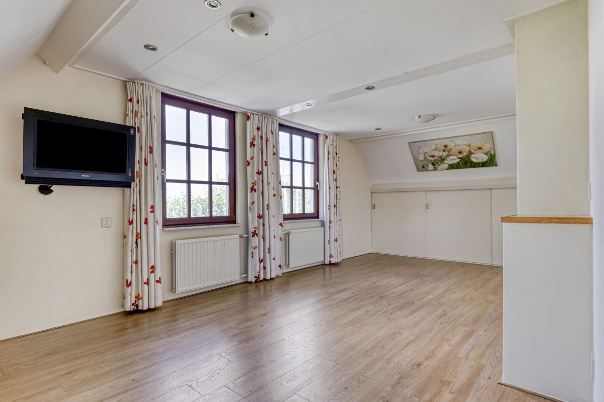 Te koop: Foto Woonhuis aan de Boddens Hosangweg 22 in Woubrugge