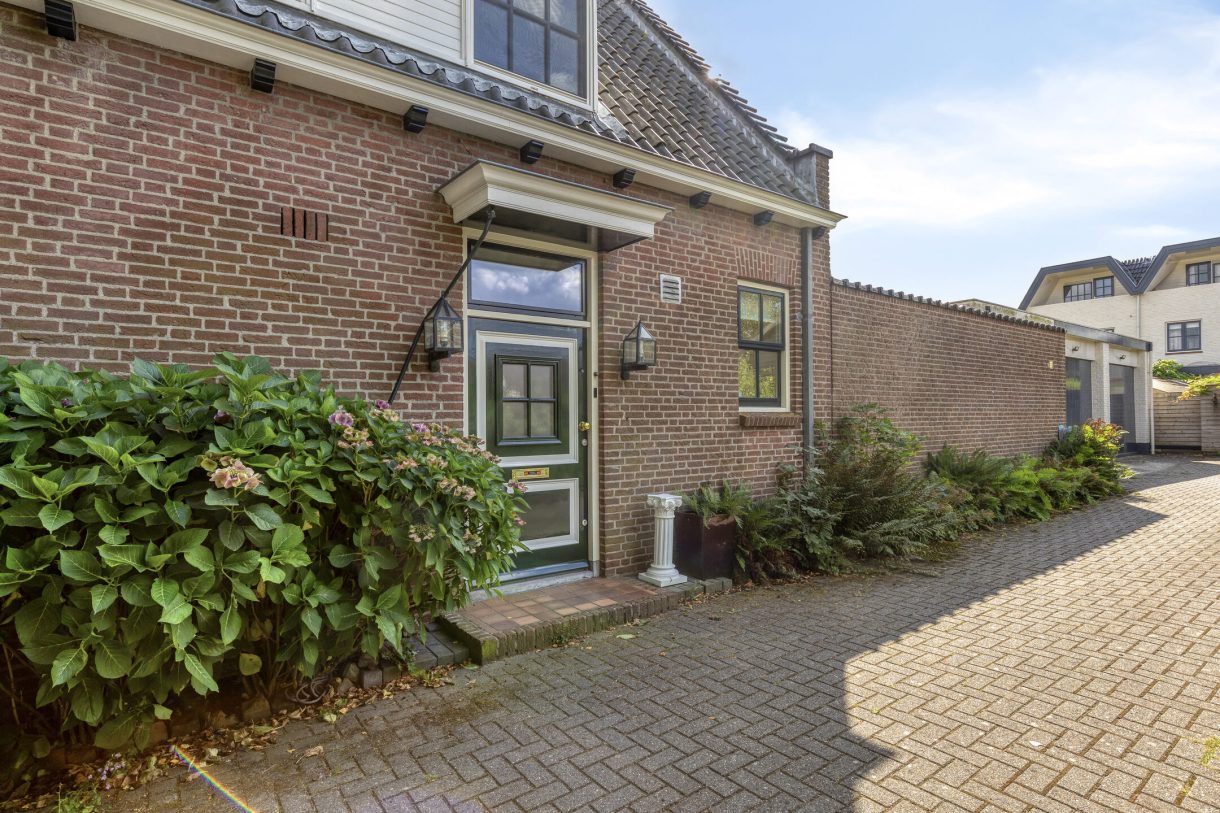 Te koop: Foto Woonhuis aan de Boddens Hosangweg 22 in Woubrugge