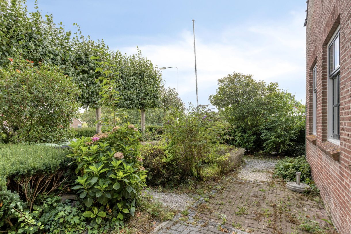 Te koop: Foto Woonhuis aan de Boddens Hosangweg 22 in Woubrugge