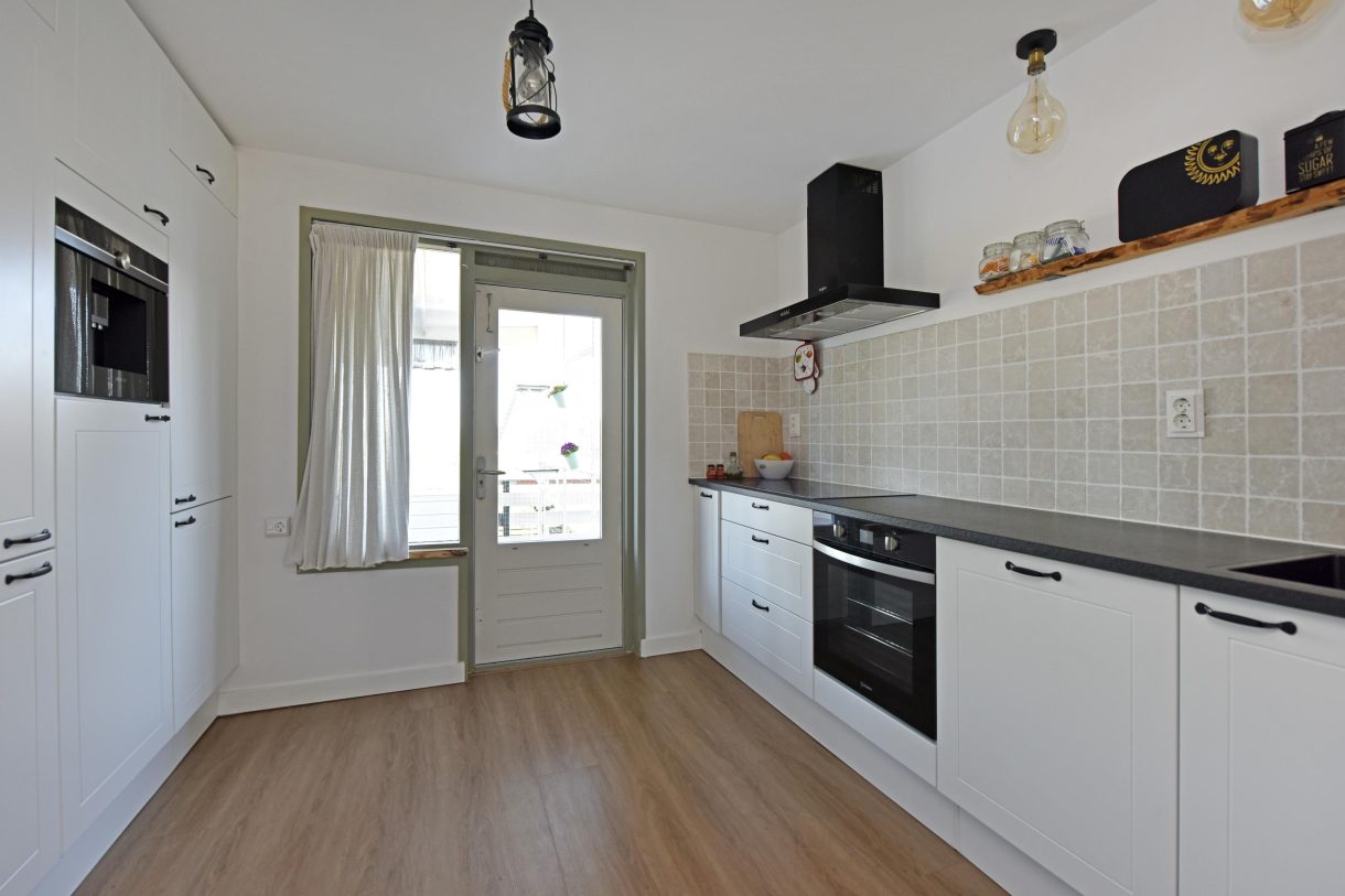 Te koop: Foto Woonhuis aan de Boddens Hosangweg 23 in Woubrugge