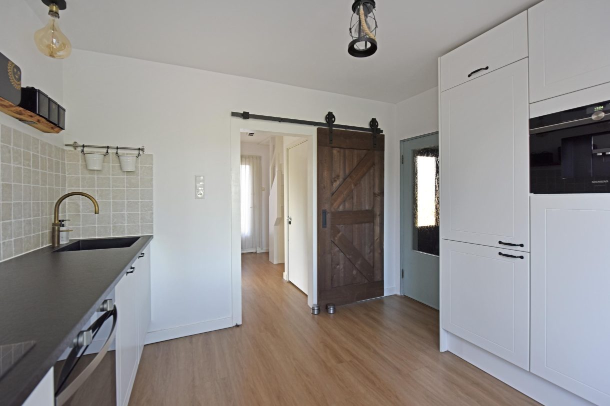 Te koop: Foto Woonhuis aan de Boddens Hosangweg 23 in Woubrugge